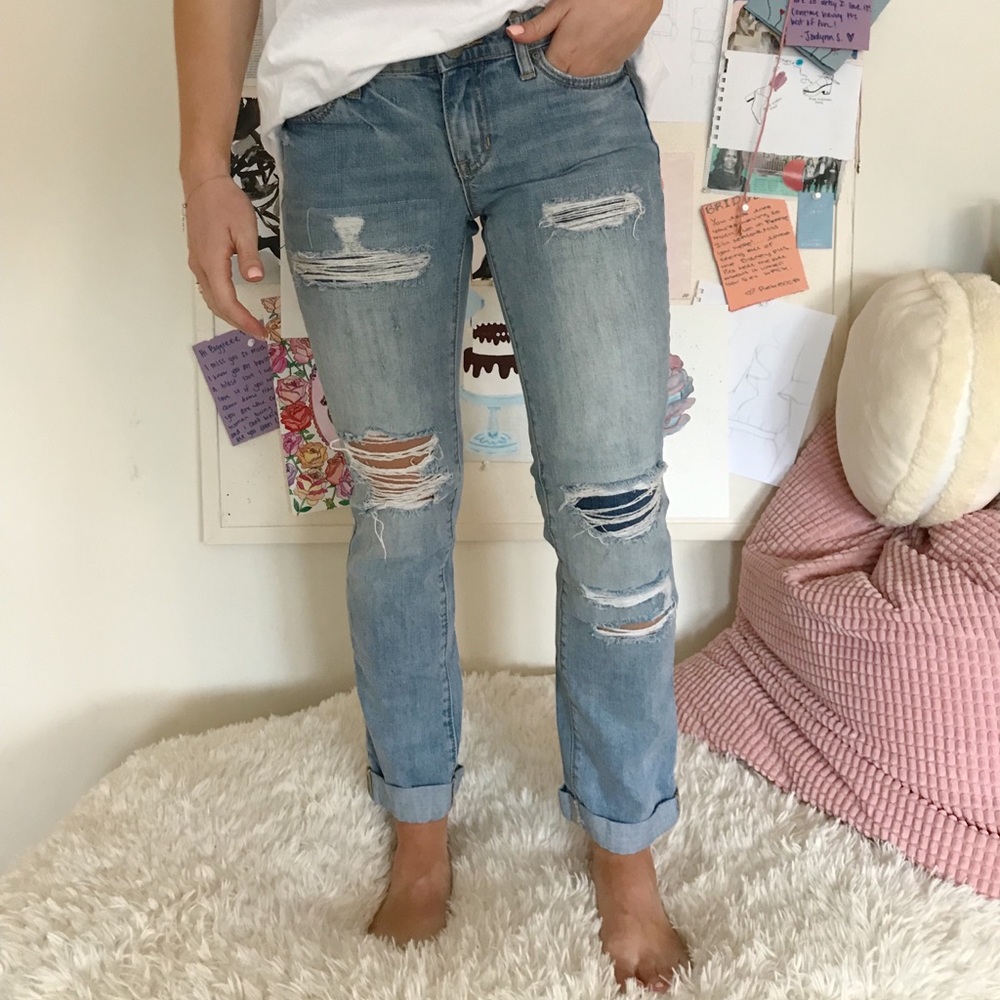 Distressed light wash denim jeans